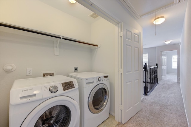 laundry room with visible vents, light colored carpet, attic access, laundry area, and independent washer and dryer