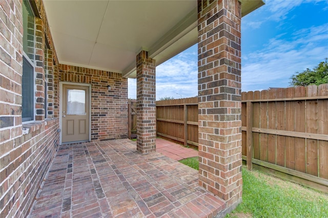 view of patio featuring fence