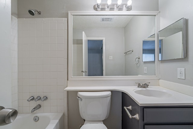 bathroom featuring visible vents, toilet, a textured ceiling, bathing tub / shower combination, and vanity