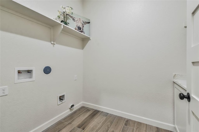 laundry area featuring laundry area, dark wood-type flooring, baseboards, and washer hookup