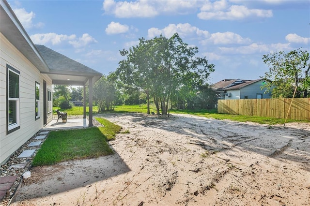 view of yard with a patio and fence