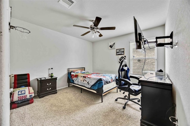 bedroom featuring visible vents, ceiling fan, and carpet