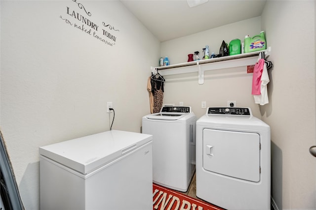 washroom with laundry area and independent washer and dryer