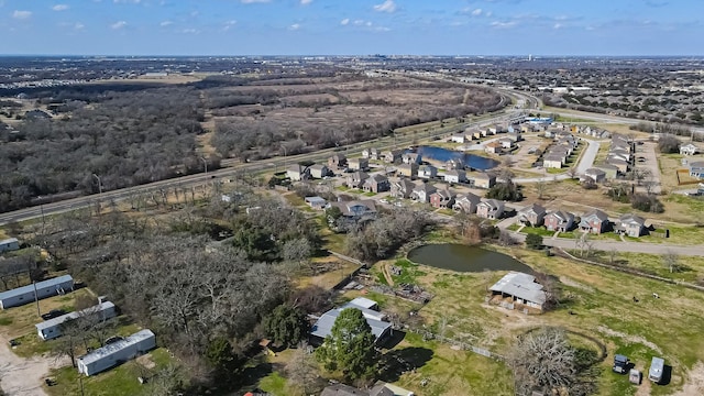 birds eye view of property featuring a residential view and a water view