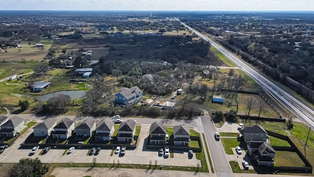 birds eye view of property with a residential view