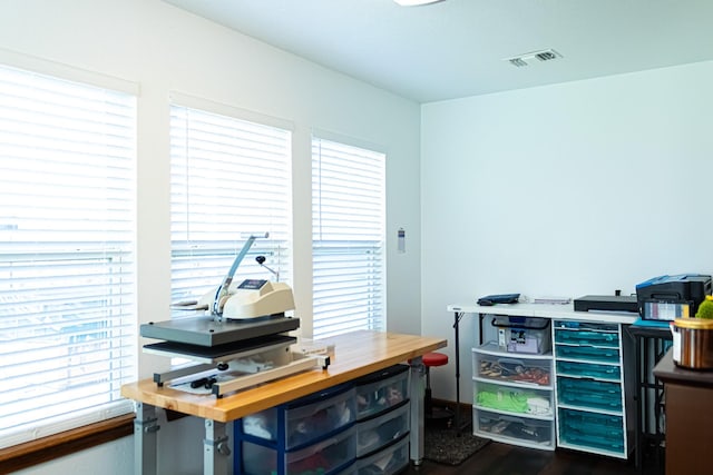 office area with dark wood finished floors and visible vents