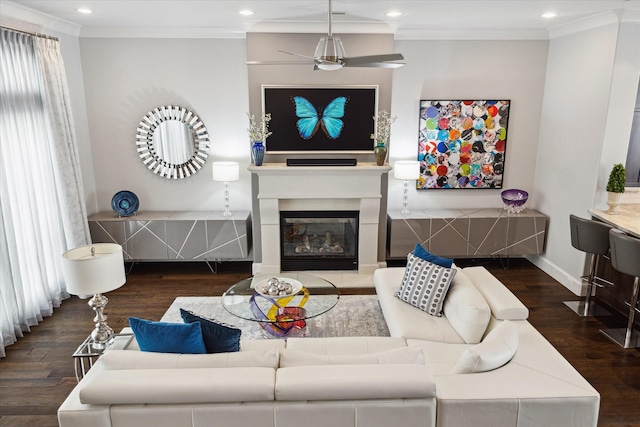 living area with crown molding, recessed lighting, ceiling fan, and wood finished floors