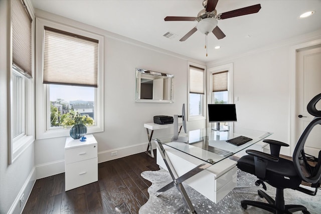 office space featuring baseboards, visible vents, a healthy amount of sunlight, and dark wood-type flooring