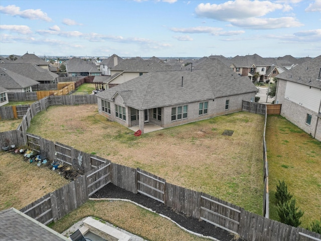 birds eye view of property with a residential view