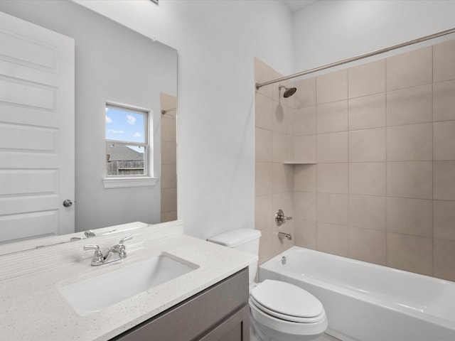 bathroom with shower / washtub combination, toilet, and vanity