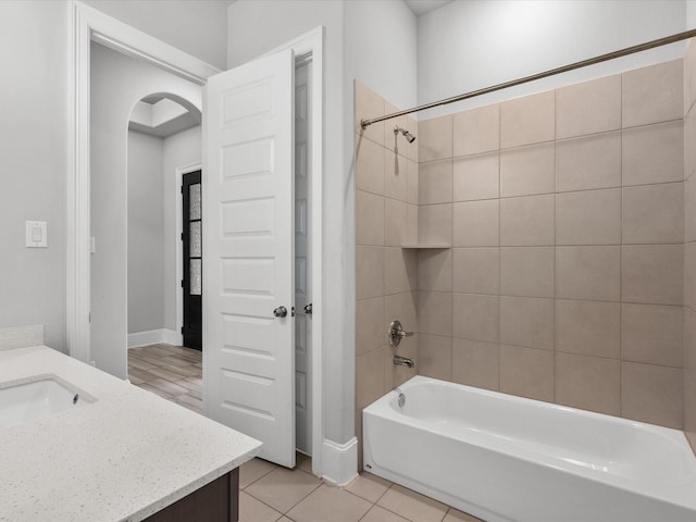 full bath featuring tile patterned flooring, vanity, and shower / bath combination