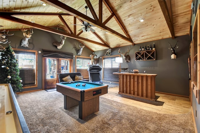 playroom with a ceiling fan, carpet floors, bar, wood ceiling, and beamed ceiling