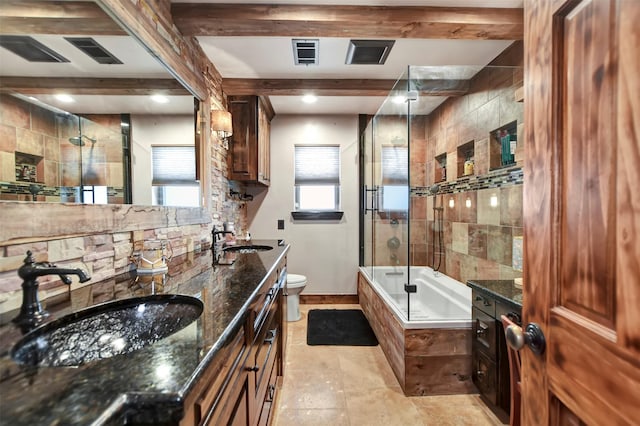 bathroom featuring beam ceiling, enclosed tub / shower combo, toilet, and a sink