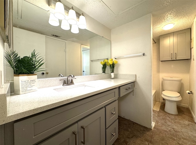 bathroom with vanity, baseboards, visible vents, a textured ceiling, and toilet