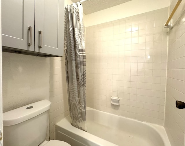 bathroom with shower / tub combo, toilet, and a textured ceiling