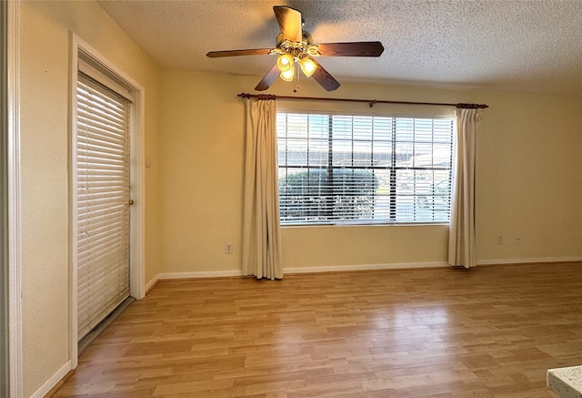 unfurnished bedroom featuring baseboards, a textured ceiling, and light wood finished floors