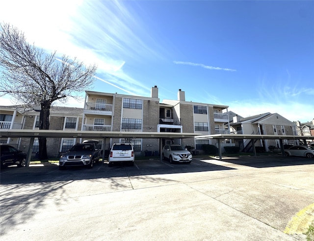 view of property with covered parking