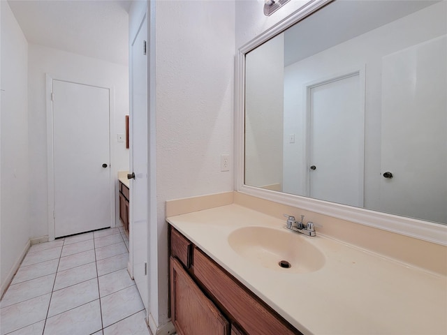 bathroom featuring tile patterned floors and vanity