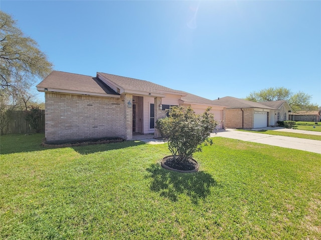 ranch-style house with brick siding, an attached garage, driveway, and a front yard