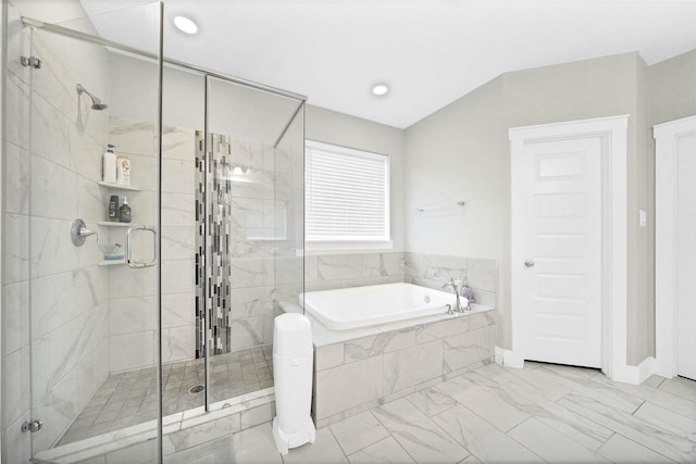 bathroom featuring a garden tub, a stall shower, and marble finish floor