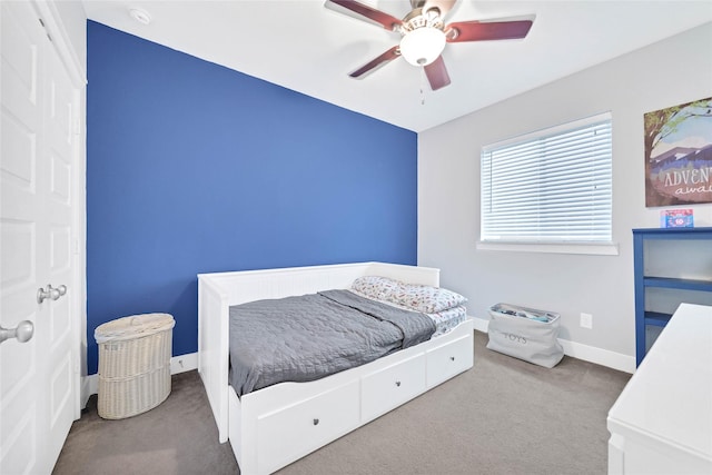 bedroom featuring a ceiling fan, baseboards, and carpet floors