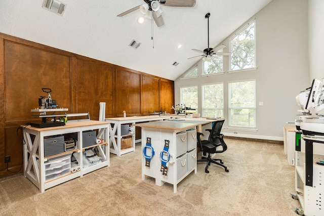 office space featuring visible vents, light colored carpet, ceiling fan, and high vaulted ceiling