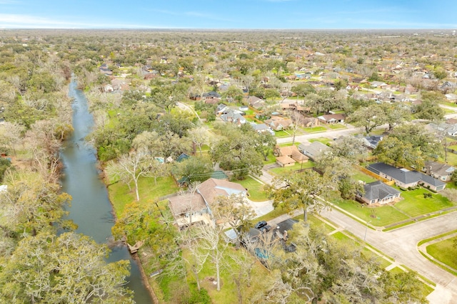 bird's eye view featuring a water view and a residential view