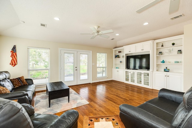 living area featuring a ceiling fan, wood finished floors, visible vents, recessed lighting, and french doors