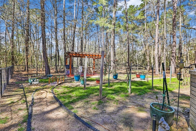 exterior space with a pergola and fence