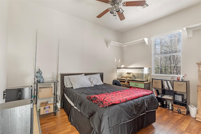 bedroom featuring ceiling fan and wood finished floors