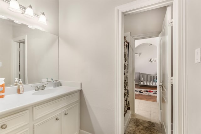 full bathroom with tile patterned floors, curtained shower, and vanity