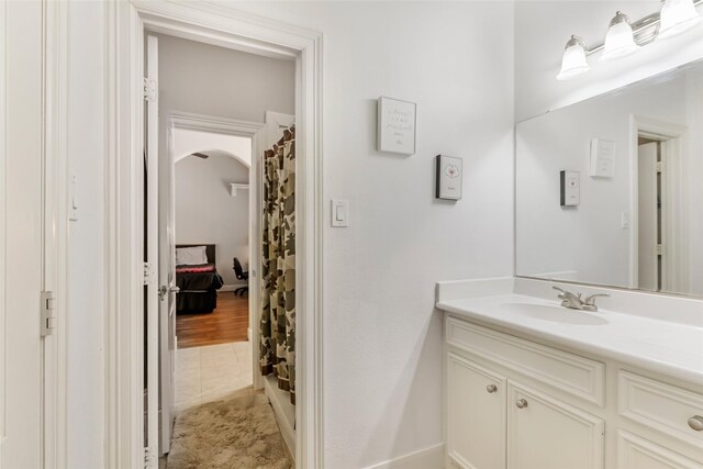 full bath with tile patterned floors, curtained shower, and vanity