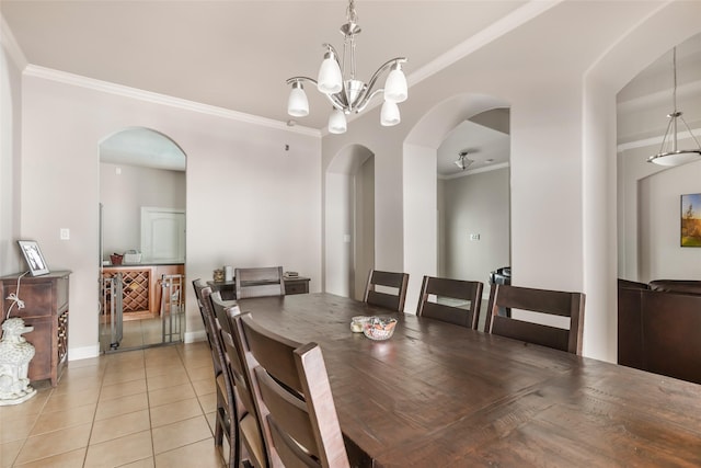 21971 Blazing Trl, New Caney, TX 77357 - dining room featuring a chandelier, crown molding, baseboards, arched walkways, and light tile patterned floors