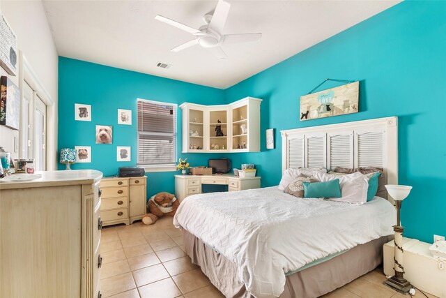 21971 Blazing Trl, New Caney, TX 77357 - bedroom with a ceiling fan, light tile patterned floors, and visible vents