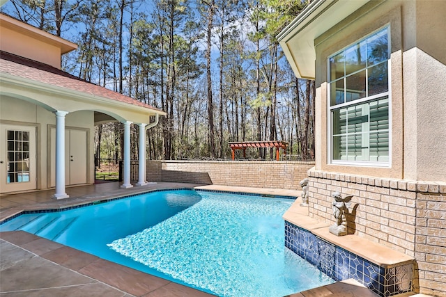 outdoor pool featuring a patio