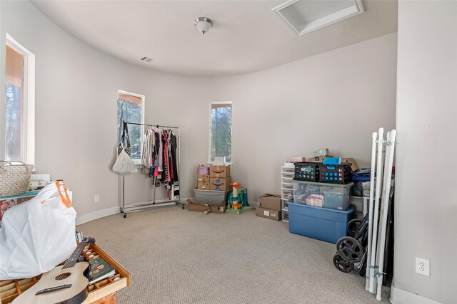 playroom with attic access, baseboards, visible vents, and carpet floors