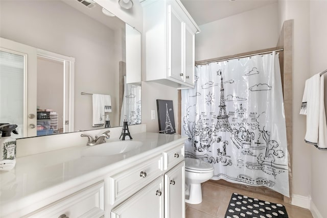 bathroom featuring vanity, tile patterned floors, toilet, and a shower with curtain