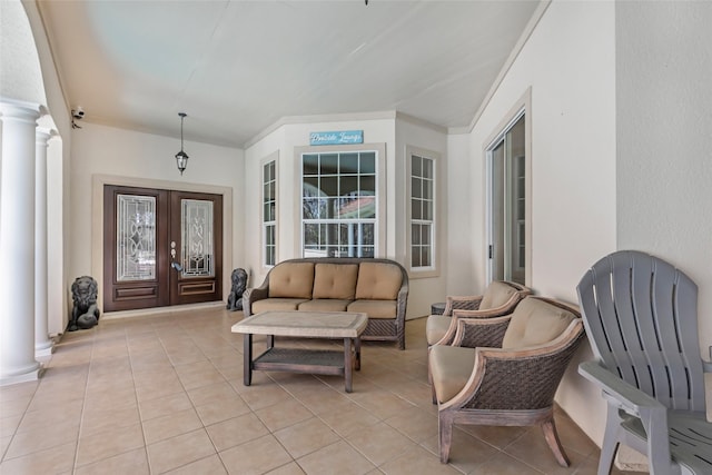 interior space featuring french doors and outdoor lounge area