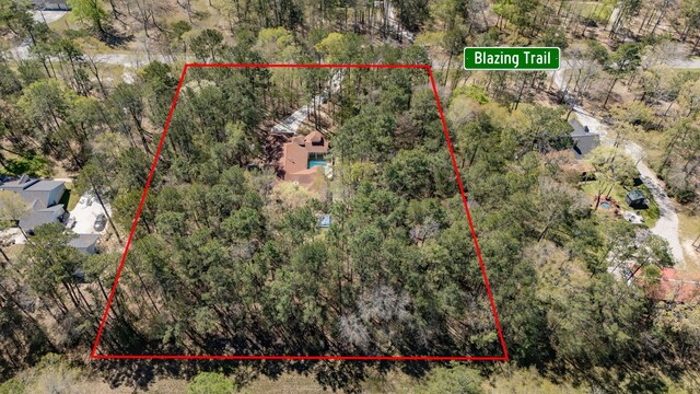 21971 Blazing Trl, New Caney, TX 77357 - bird's eye view featuring a forest view