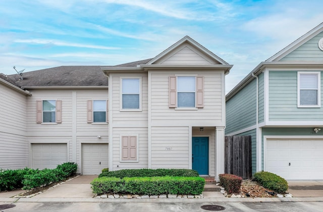 townhome / multi-family property featuring an attached garage and driveway