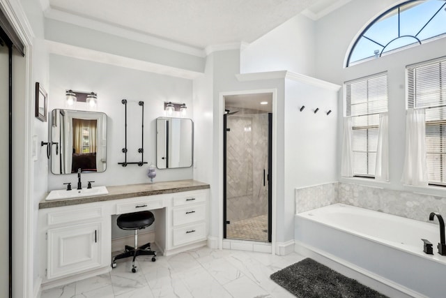 bathroom featuring crown molding, a garden tub, a stall shower, marble finish floor, and vanity