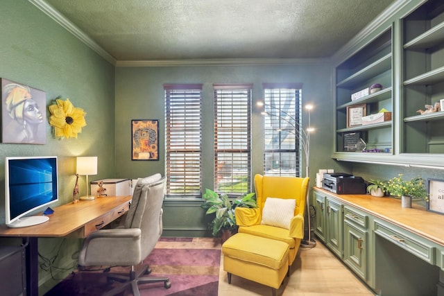 office space with a textured ceiling, light wood-type flooring, and ornamental molding