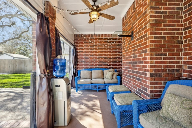 view of patio / terrace featuring ceiling fan and fence