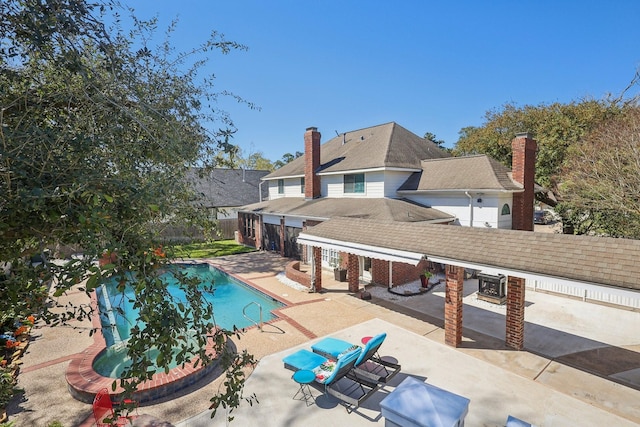 view of swimming pool featuring a patio area, a fenced in pool, and a fenced backyard