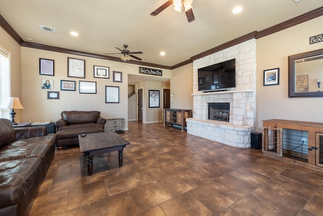 living area with a ceiling fan, visible vents, recessed lighting, a fireplace, and ornamental molding