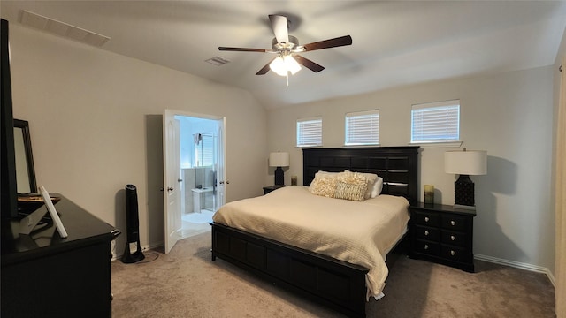 bedroom with vaulted ceiling, baseboards, visible vents, and light carpet