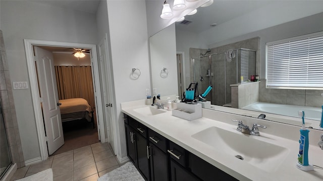 full bath featuring tile patterned flooring, a stall shower, and a sink