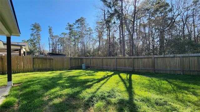 view of yard with a fenced backyard