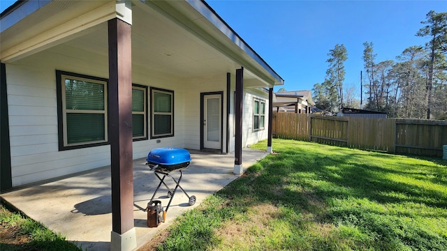 view of yard featuring fence and a patio area