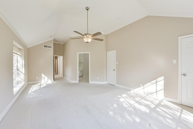 empty room featuring visible vents, high vaulted ceiling, baseboards, light colored carpet, and ceiling fan